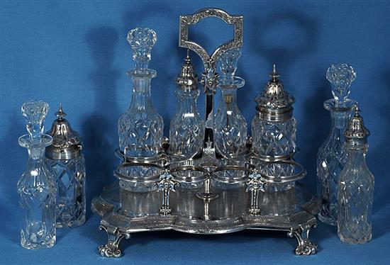 A Victorian silver eight bottle cruet stand and eight original bottles, by Walter & John Barnard, height 280mm, weight 40oz